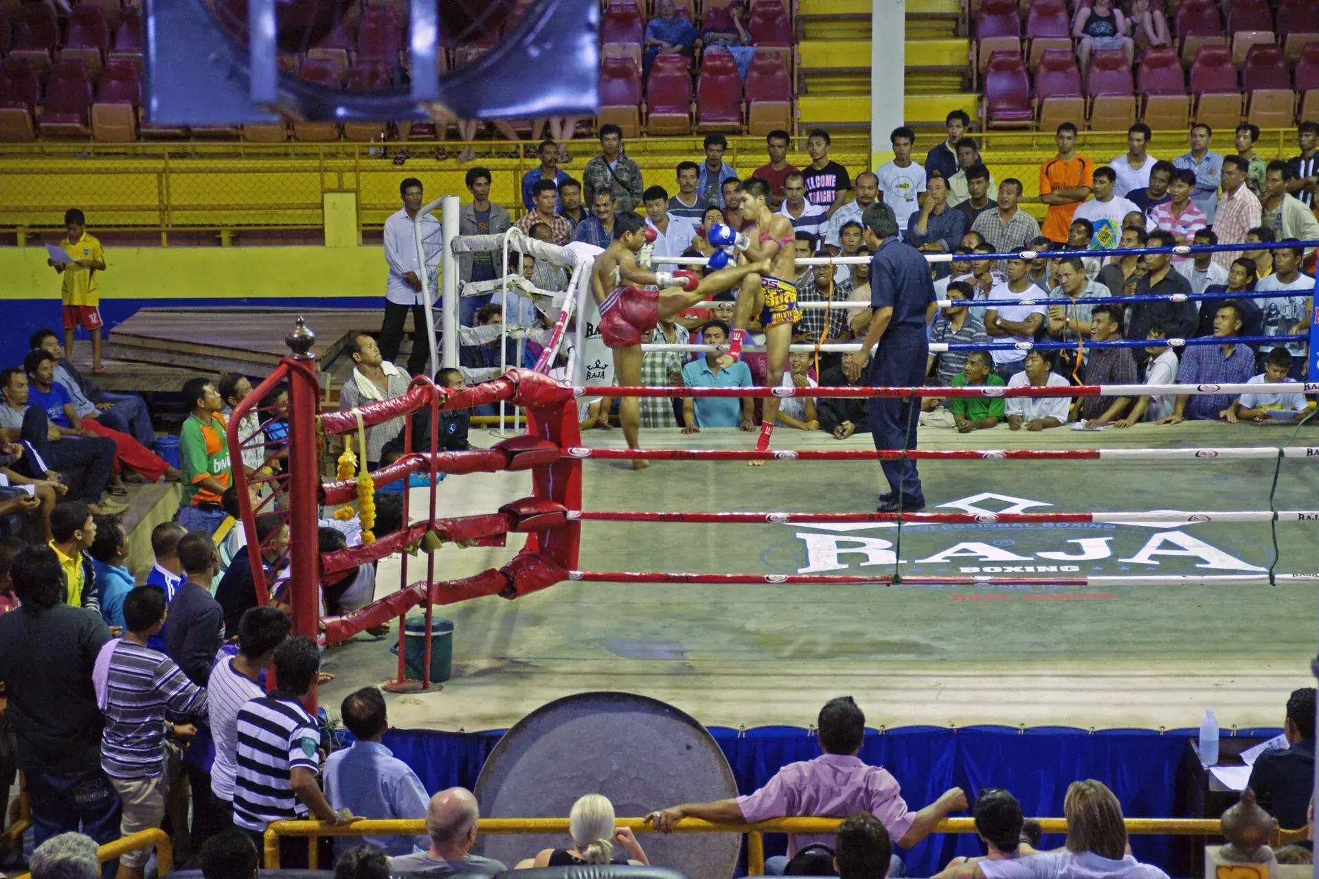 Two boxers in the clinch in a ring at Ao Nang, Thailand
